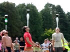 Juggling Games - Competitors balancing a pint of guiness on top of a club on their chin!